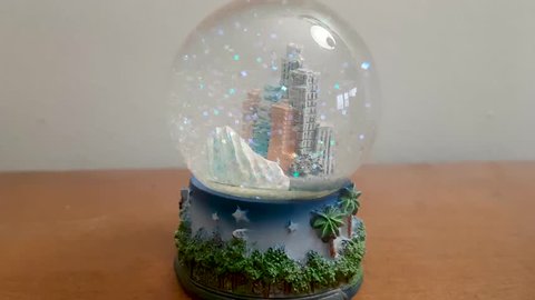Snow globe flakesing after it was shaken