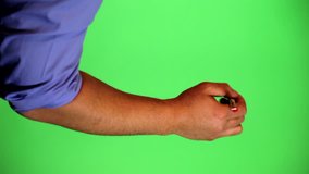 An arm in front of a green screen to be keyed and used at will. Rotate image for best results. Originally used for a few animated whiteboard videos. Red marker writing up and down.