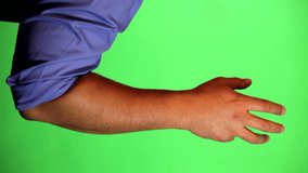 An arm in front of a green screen to be keyed and used at will. Rotate image for best results. Originally used for a few animated whiteboard videos. Hand rotating a large knob.
