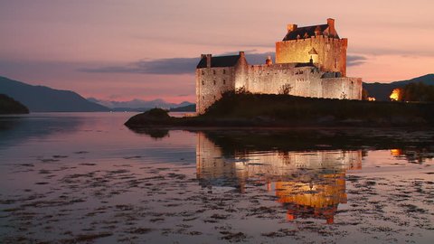 Static shot of Eilean Donan Castle at sunset, Kintail National Scenic Area, Dornie, western Highlands,  Scotland
