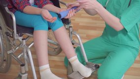 portrait doctor and child in wheelchair rehabilitation therapy close up - Powered by Shutterstock - Get 15% off with code: PIKWIZARD15
