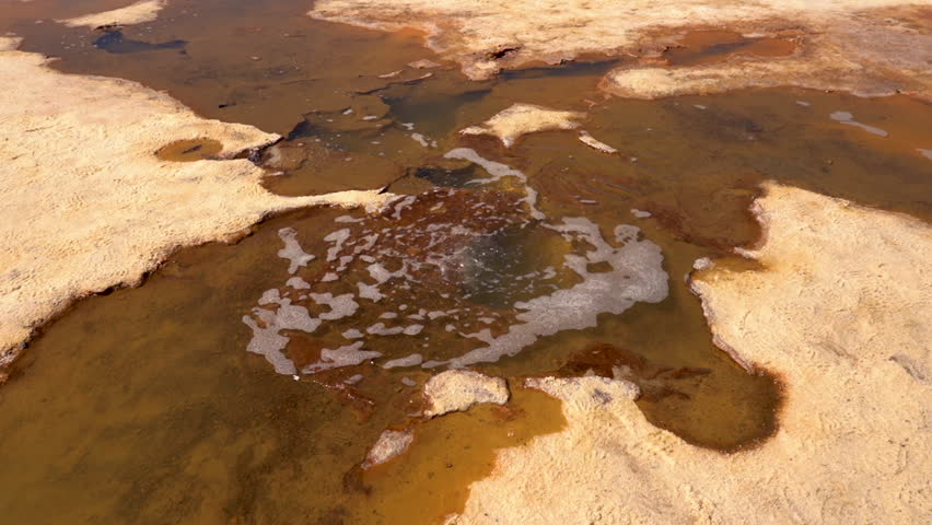 Boiling pond in the salt flat of Uyuni in Bolivia