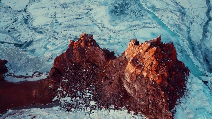Separate stone cliff Shamanka near the coast of Olkhon Island. Lake Baikal. Early cool morning. Siberian spring