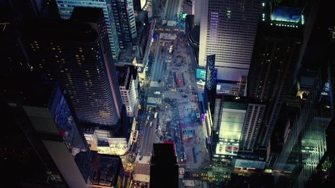 Aerial view of bright lights and busy night life in Times Square, New York City. Shot on 4k RED camera.