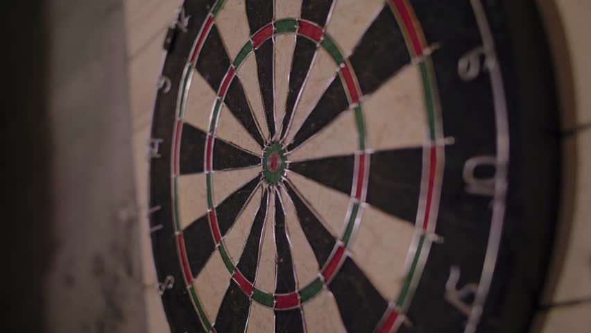 Close up shot of a dart board. Darts arrow Missing the target on a dart board during the game. Royalty-Free Stock Footage #1026360134