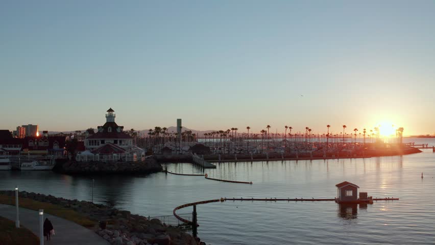 Golden sunrise over Long Beach Harbor, California, Aerial Tracking Shot