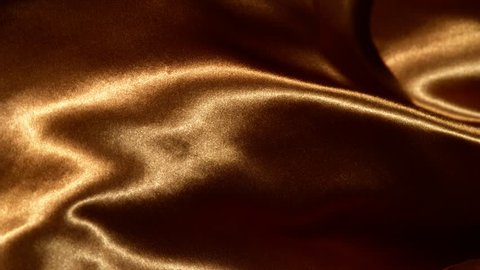 Super slow motion of waving gold velvet cloth in detail. Filmed on high speed cinema camera, 1000fps.