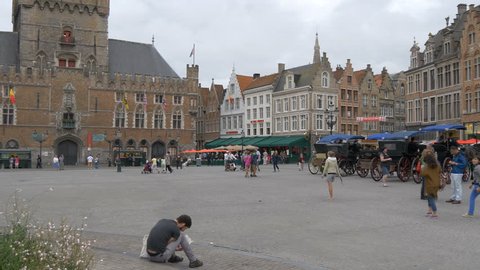 Belgium, Bruges - October, 2016: People in Market square, Bruges
