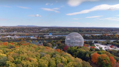 Montreal, Quebec, Canada, aerial view of the Biosphere Environmental Museum showing maple trees changing colour in Fall season.