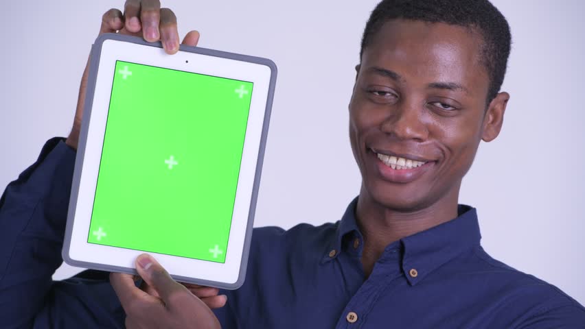 Face of young happy African businessman showing digital tablet