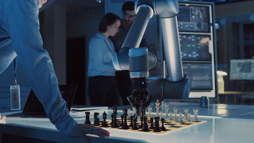 Professional Japanese Development Engineer is Testing an Artificial Intelligence Interface by Playing Chess with a Futuristic Robotic Arm. They are in a High Tech Modern Research Laboratory. | Shutterstock HD Video #1026410225