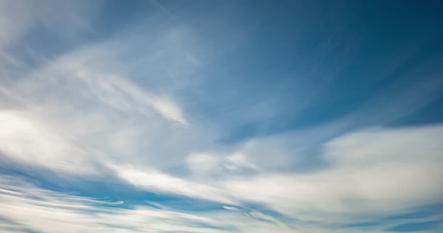 Timelapse of Blue sky background with tiny stratus cirrus striped clouds. Clearing day and Good windy weather  Royalty-Free Stock Footage #1026413417
