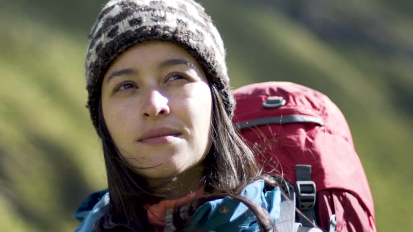 white woman hiker backpacker girl on the mountain - slow motion 
