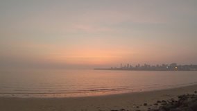 Beautiful orange weather after a sunset on Marine drive beach, Mumbai, Maharashtra, India Stock video 