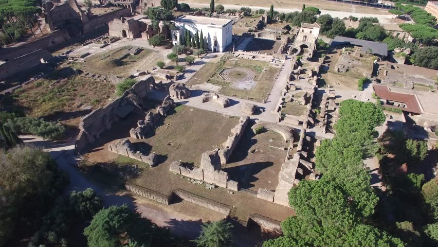 Aerial fly around over the ruins of Domus Flavia (Flavian Palace) and the Palatine Hill. Rome.