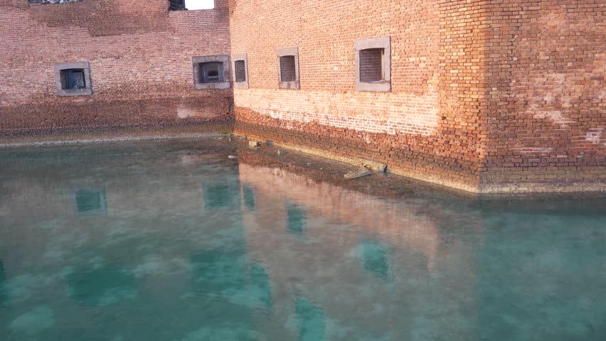 Landscape view of the moat outside of Fort Jefferson during the day in Dry Tortugas National Park (Florida).