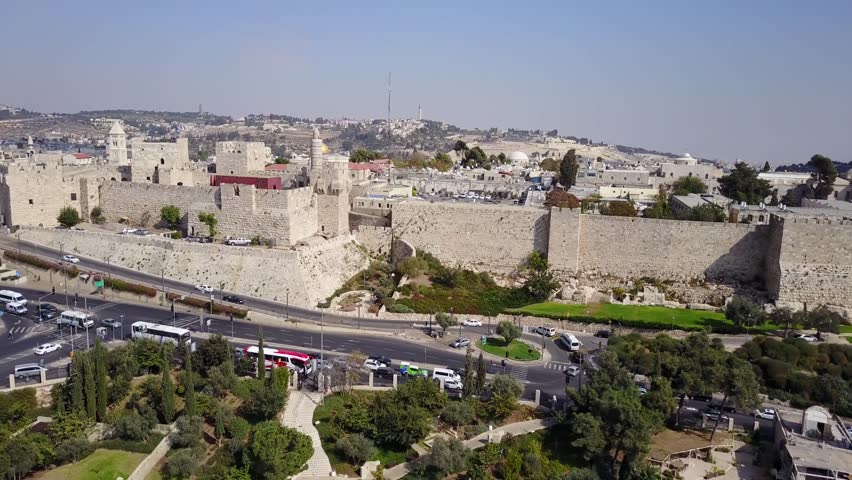 Left side aerial truck shot of the Tower of David Museum, the Jaffa Gate and the entrance to the Mamilla shopping mall, with a beautiful view on the Dome of the Rock and the Temple Mount.