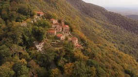 Aerial view of tourists strolling on the walkways outside Nekresi Monastery. one of the largest complexes in the Kakheti Region of Georgia. Ultra HD 4k video