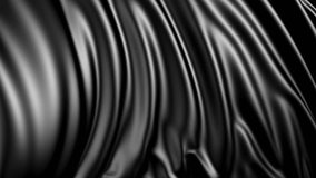 Black fabric in slow motion. The fabric develops smoothly in the wind. Wind waves spread through the fabric. This version of the fabric in smooth motion is suitable for almost any video