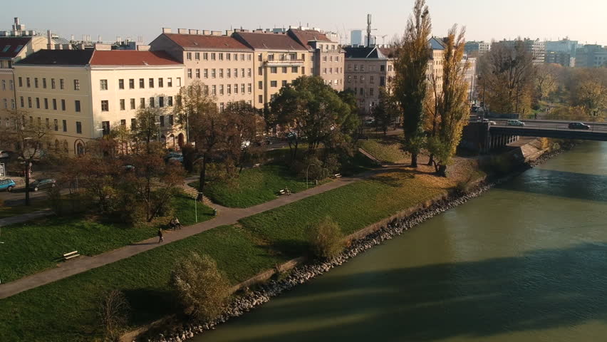 AERIAL Drone shot: Cars driving along the Danube channel / Donaukanal in Vienna.