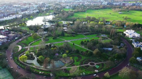 Aerial drone bird's eye view video of famous Regent's Royal Park unique nature and Symetry of Queen Mary's Rose Gardens as seen from above at sunset, London, United Kingdom