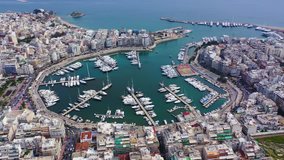 Aerial drone video of famous busy port and safe dock of Bay of Zea or Pasalimani (Pasha's harbour) in the heart of Piraeus, Attica, Greece