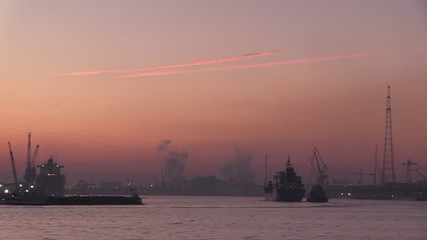 cargo ships coming in at dawn at the port of Antwerp and its industry