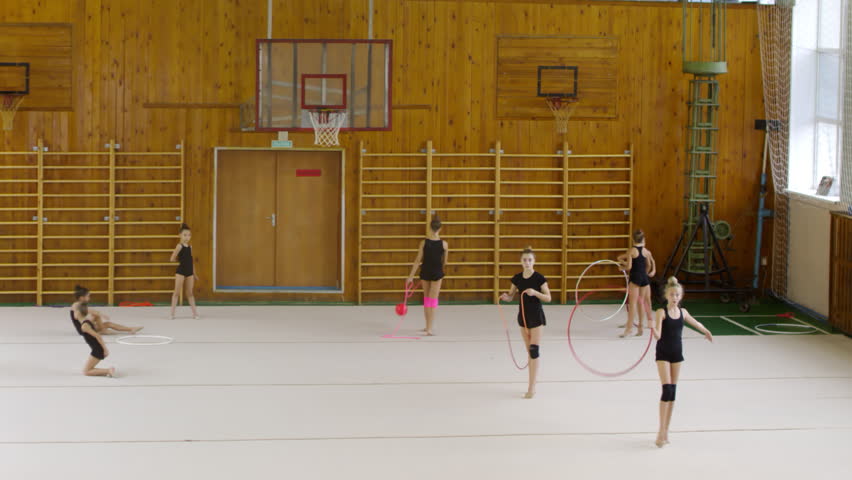 Sequence of videos of young teenage girls dancing with ribbons while training in rhythmic gymnastics class