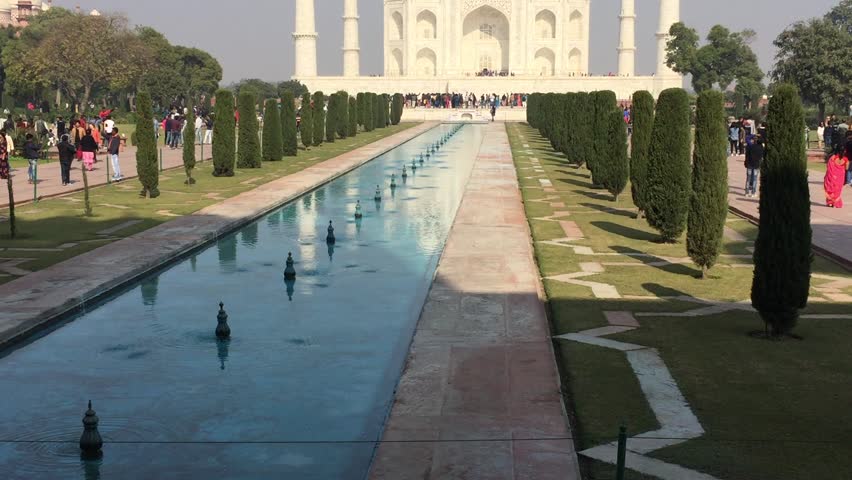 View of Taj Mahal and spectacular reflections on Water. Agra, India