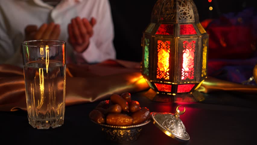 Fasting during Ramadan. Breaking the fast. Religious muslim man praying | Shutterstock HD Video #1026463496