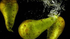 Pears fall in water. Slow motion. - Powered by Shutterstock - Get 15% off with code: PIKWIZARD15