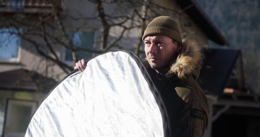 Professional bouncer on a film set bouncing,reflecting light