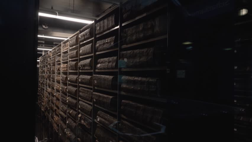 Big old books in shelves at the city archive in Amsterdam. The stadsarchief in the Bazel building at the Vijzelsgracht.