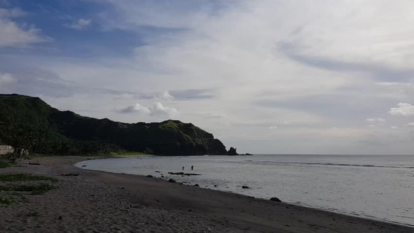 High hills behind a beach shore in Batanes, Philippines