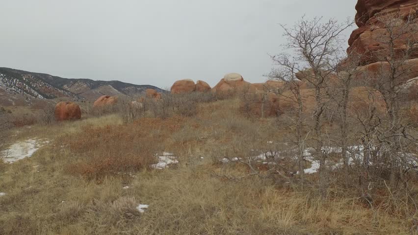 Reveal shot of Colorado mountains and plains