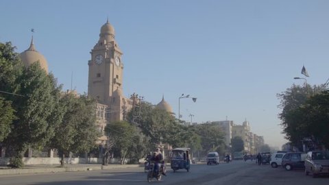 Karachi Metropolitan Corporation (KMC) Building is a historic building, built in the British Era, located at M. A. Jinnah road. Traffic goes by, early morning in Karachi, Pakistan.