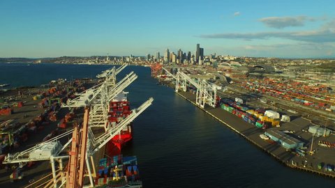 Seattle Aerial v8 Flying low over large shipyard ports towards city center. 3/15