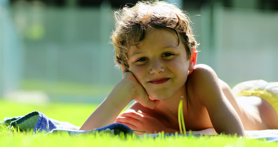 Child boy portrait waving to camera HELLO or GOODBYE