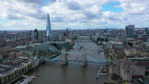 City of London / United Kingdom - March 16 2019: Aerial drone video of iconic Tower Bridge in the heart of City of London