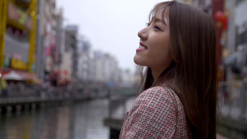 Cute woman sightseeing  in famous tourist destination, Osaka Japan. HD, Slow motion.