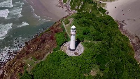 Flying around above the old Lighthouse Honey Island (Ilha do Mel), Parana, Brazil