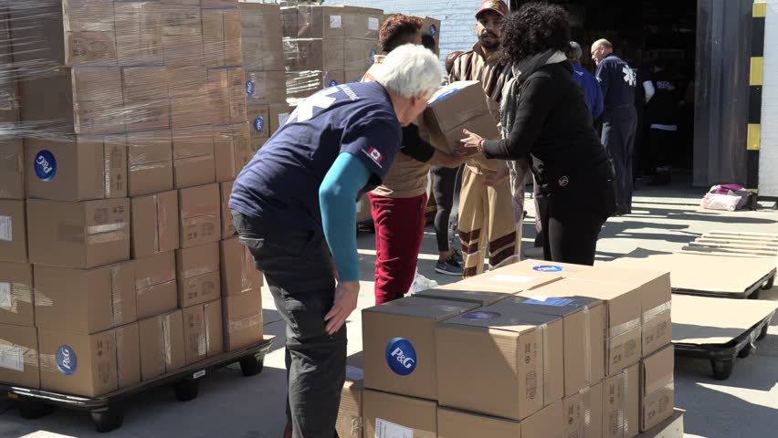 Toronto, Ontario, Canada March 2019 Global medic aid workers in Toronto package emergency help for Cyclone Idai victims in Mozambique