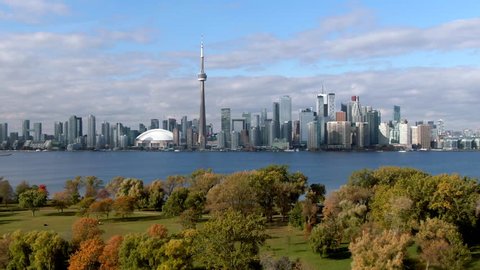 Toronto, Ontario, Canada, flyover shot of Toronto Island showing Lake Ontario and Toronto skyline in Fall season, aerial view.
