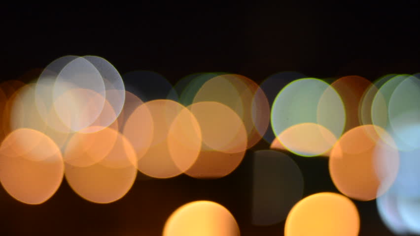 defocused street lights and car headlights at night creating amazing bokeh
