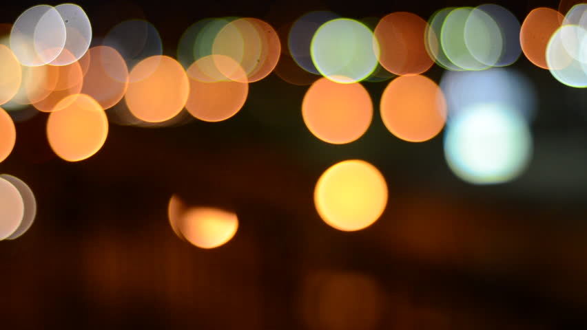 defocused street lights and car headlights at night creating amazing bokeh