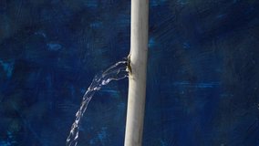 Water flows from a crack in the pipe. - Powered by Shutterstock - Get 15% off with code: PIKWIZARD15