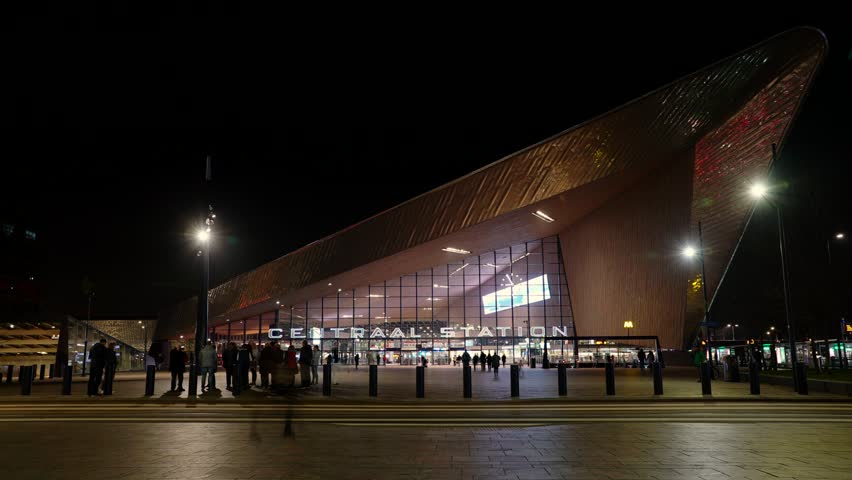 Rotterdam 29 March 2019, Rotterdam central station time lapse at night lot of traffic and light trails. Rotterdam central station is a landmark and becoming a major tourist attraction. 
