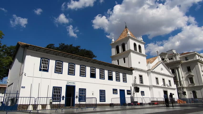 Sao Paulo, Brazil, December 14, 2018. time lapse of people walking in front of facade of Pateo do Collegio, the site of foundation of the city of Sao Paulo
