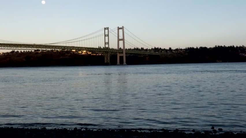 moon rising over tacoma narrows bridge in spring