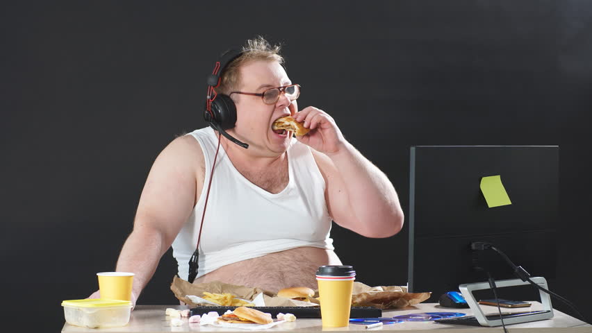 hungry overweight man eating hamburger while Stok Videosu (%100 Telifsiz) 1...